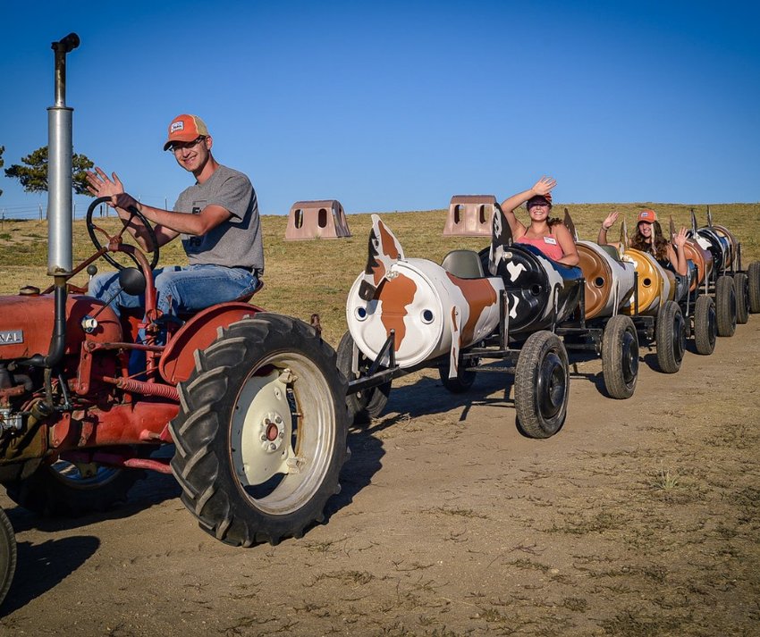 People take a ride in a photo from The Patch, a farm in Elbert County that puts on fall festivities. The farm sits near the Town of Elizabeth.